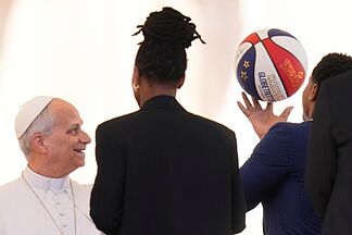 Pope Leo XIV tries to spin a basketball on his finger Harlem Globetrotters style