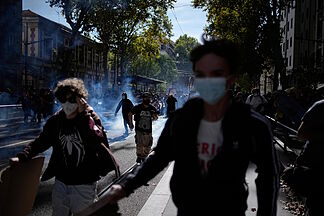 A student loses a hand in clashes with police in France