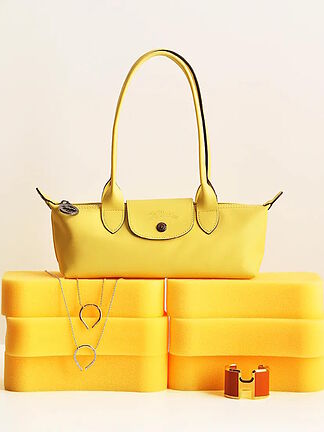 Fashion insiders will elevate their looks this season with these statement accessories--from the yellow handbag to the pink bracelet