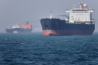 Trench Warfare Among Persian Gulf Oil Tankers: Why Oil Flows but Fuel Prices Don't Drop