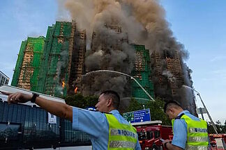 Bamboo scaffolding could be responsible for the spread of the fire in Hong Kong with at least 55 dead and nearly 300 missing